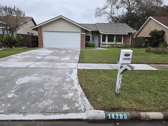 ranch-style home with a garage and a front lawn