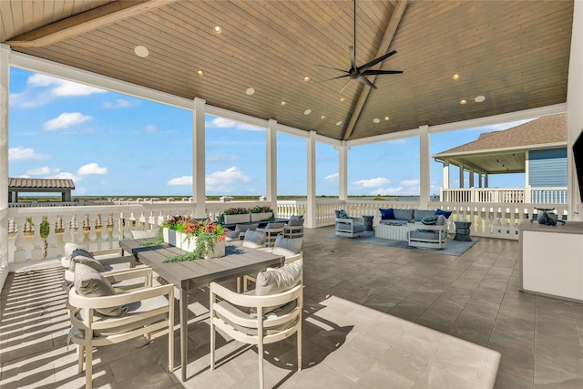 view of patio / terrace with a water view, a gazebo, outdoor lounge area, and ceiling fan