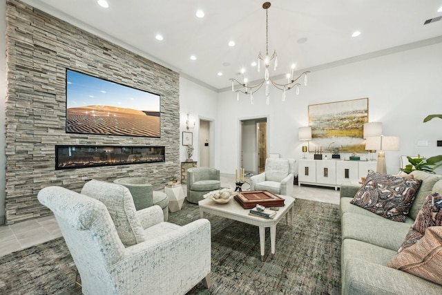 living room featuring ornamental molding, a fireplace, and light tile patterned floors