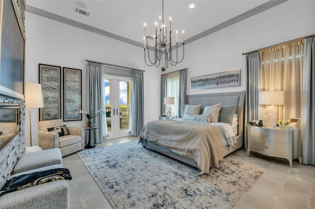 tiled bedroom with an inviting chandelier, a fireplace, a towering ceiling, and access to outside