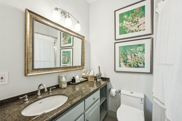 bathroom with vanity and toilet