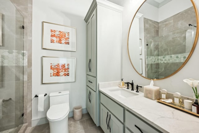 bathroom with vanity, tile patterned flooring, a shower with door, and toilet