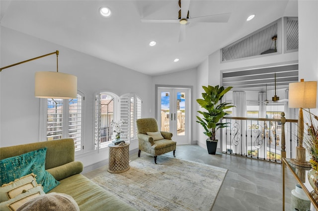 sitting room featuring lofted ceiling, french doors, and ceiling fan