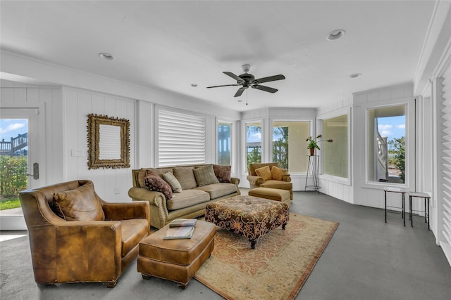 living room featuring a wealth of natural light and ceiling fan