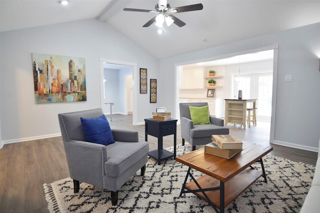 living room with vaulted ceiling with beams, dark wood-type flooring, and ceiling fan