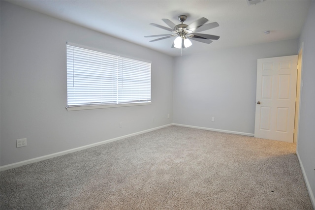 carpeted empty room with ceiling fan