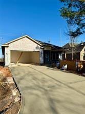 ranch-style house featuring a garage