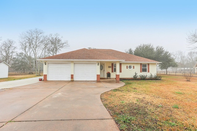 single story home with a garage and a front yard