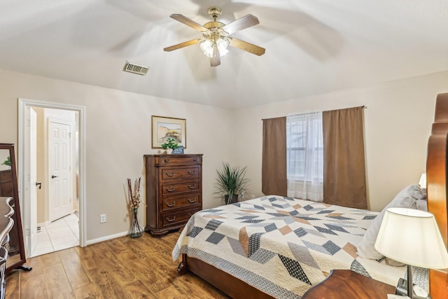 bedroom featuring hardwood / wood-style floors and ceiling fan