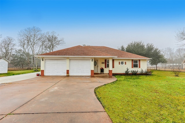 single story home with a garage and a front lawn