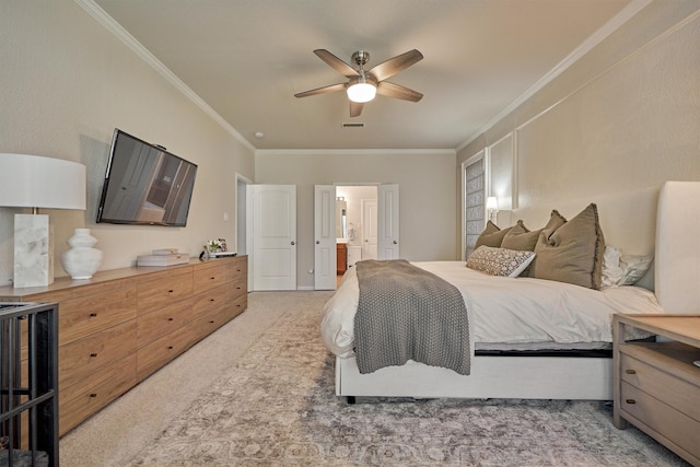 bedroom featuring light carpet, ensuite bath, ornamental molding, and ceiling fan