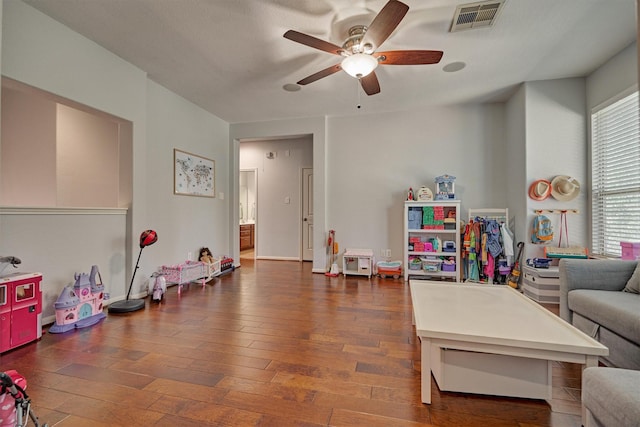 game room featuring ceiling fan and dark hardwood / wood-style flooring