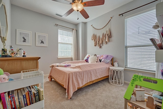 carpeted bedroom with ceiling fan