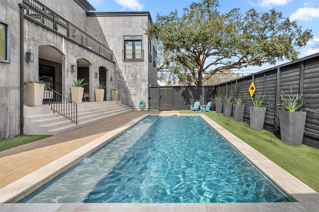 view of swimming pool with a patio