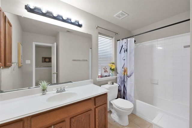 full bathroom with tile patterned floors, vanity, toilet, and shower / tub combo