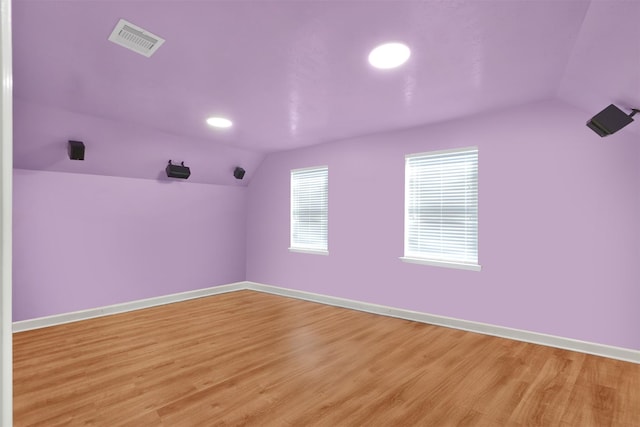 interior space featuring vaulted ceiling and light wood-type flooring