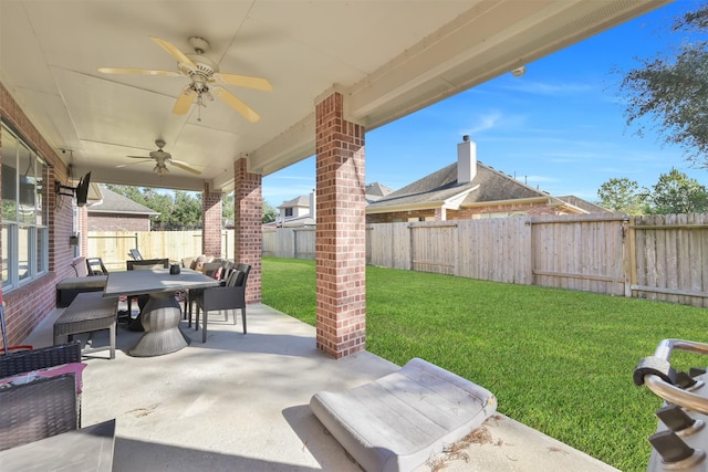 view of patio featuring ceiling fan