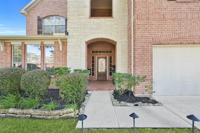 view of exterior entry featuring a garage