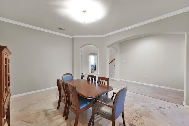 dining area featuring crown molding