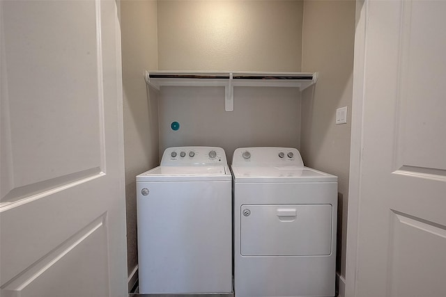 laundry area featuring washing machine and clothes dryer