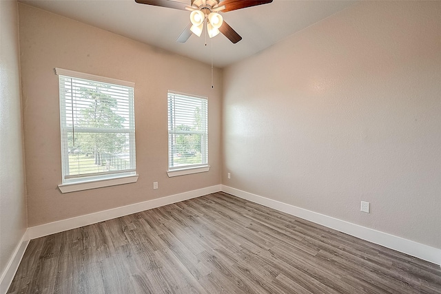 empty room with light hardwood / wood-style flooring and ceiling fan