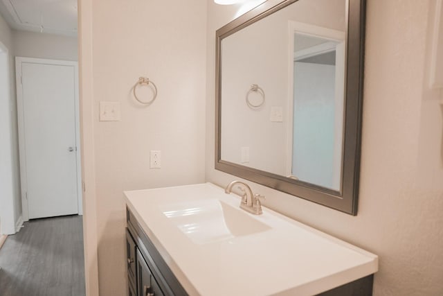 bathroom with vanity and hardwood / wood-style floors