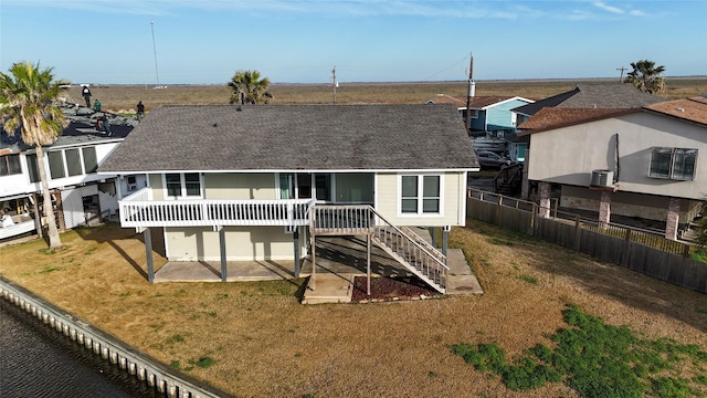 back of property with a patio and a lawn