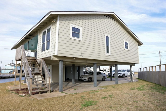 back of property featuring a lawn