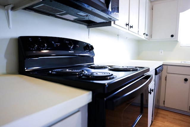 kitchen with white cabinetry, black range with electric stovetop, and light hardwood / wood-style floors