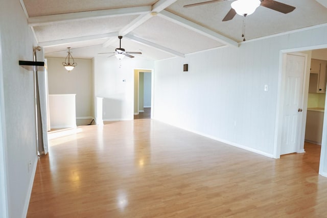 spare room featuring lofted ceiling with beams, ceiling fan, and light hardwood / wood-style floors