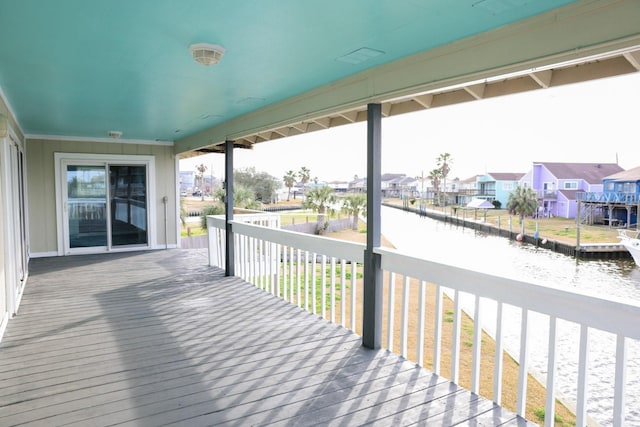 wooden deck with a water view