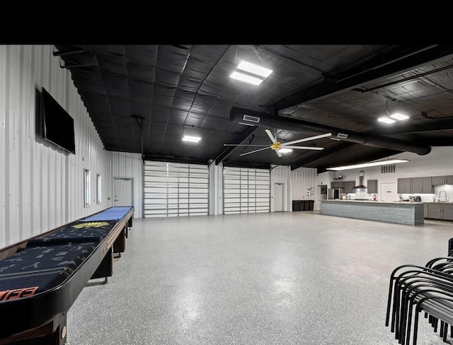 garage featuring sink and ceiling fan