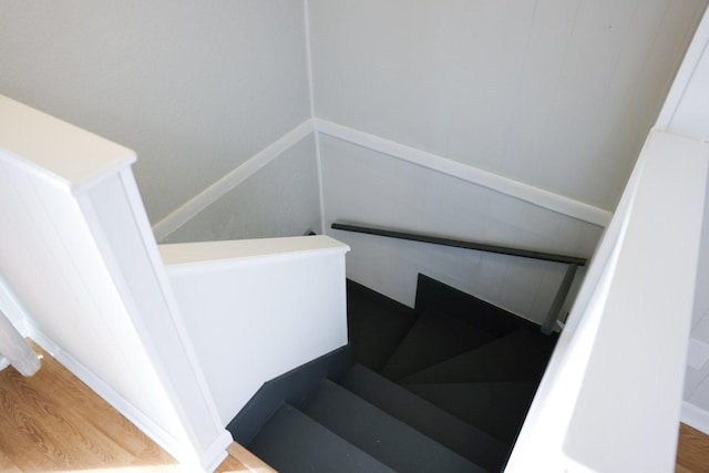 stairway featuring hardwood / wood-style floors