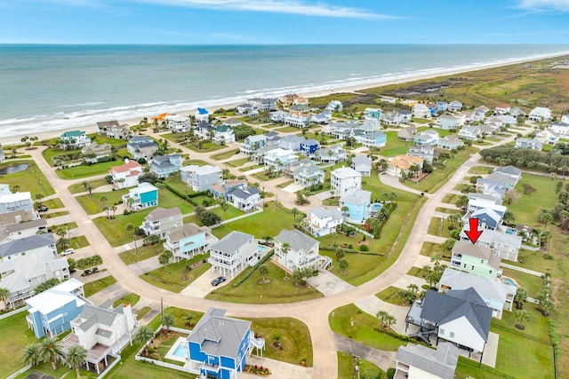 aerial view with a water view and a view of the beach