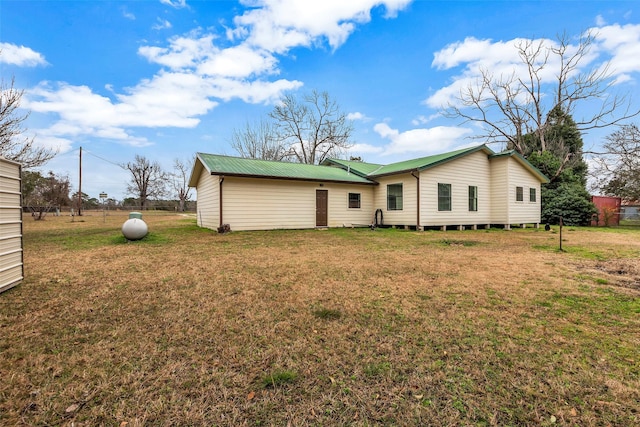 rear view of house with a lawn