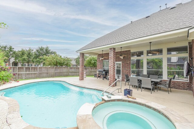 view of pool featuring an in ground hot tub, ceiling fan, and a patio area