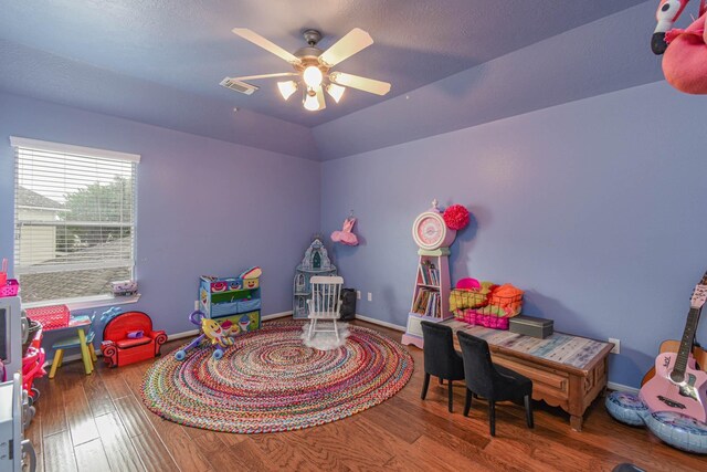 game room with wood-type flooring, vaulted ceiling, and ceiling fan