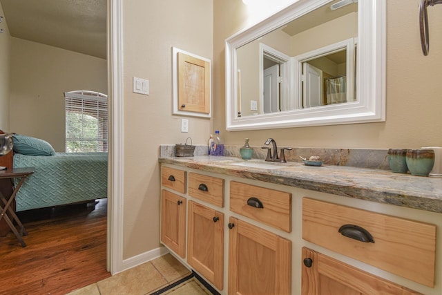 bathroom with vanity and tile patterned floors