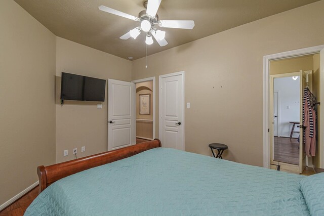 bedroom with hardwood / wood-style flooring and ceiling fan