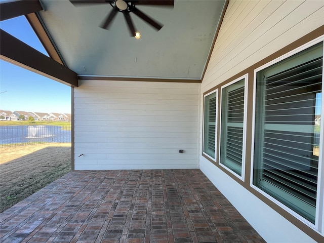 view of patio / terrace featuring ceiling fan and fence