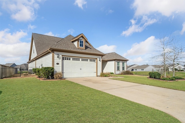 view of front of home with a garage and a front yard