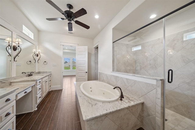 full bathroom with a stall shower, visible vents, a ceiling fan, a whirlpool tub, and vanity