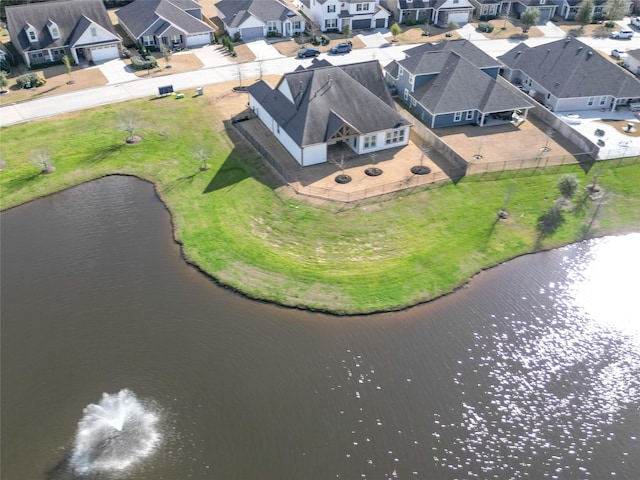 bird's eye view featuring a water view and a residential view