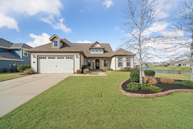 view of front of home with a garage, a water view, and a front lawn