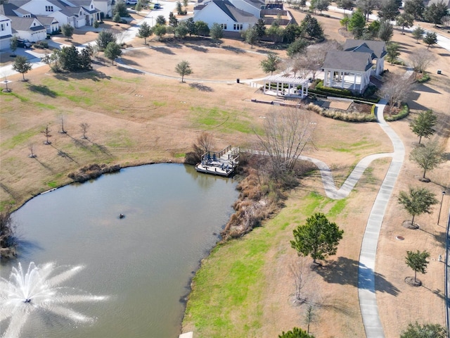 drone / aerial view featuring a residential view and a water view