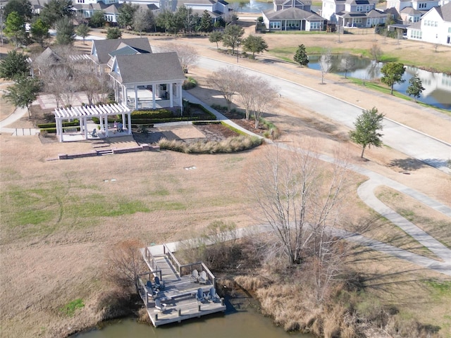 birds eye view of property featuring a residential view and a water view