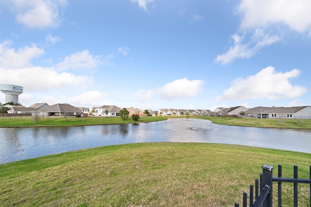 water view featuring fence and a residential view