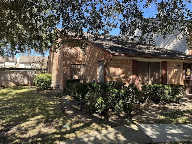 view of property exterior with a yard