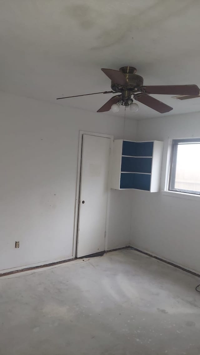 unfurnished room featuring concrete flooring