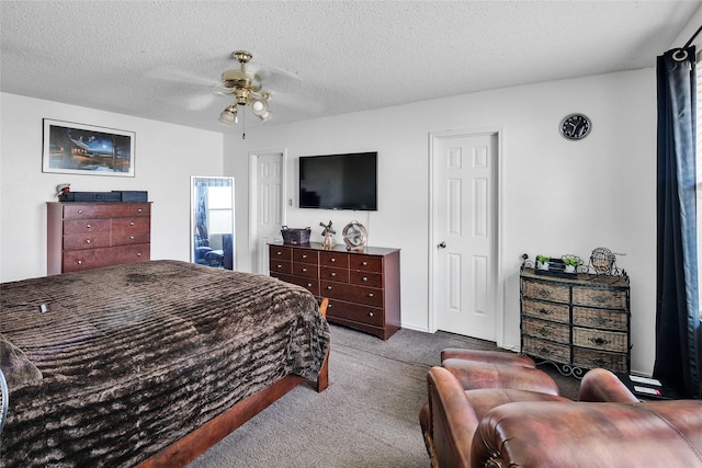 bedroom featuring light carpet, ceiling fan, and a textured ceiling